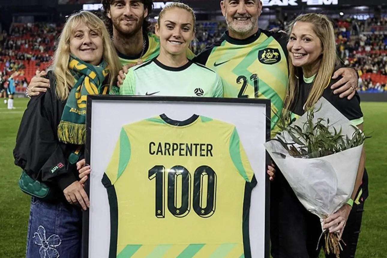 <p>Ellie Carpenter and her family on the field as they celebrate her 100th Matilda\\'s game. IMAGE: Supplied</p>\\n